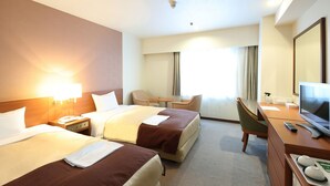 A hotel room with two beds, a desk, a chair, a television, and a window with curtains. - Hotel Pearl City Morioka (Morioka)