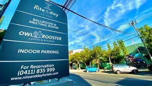 A signboard for Nite & Day Hotel listing amenities like a ballroom, meeting room, coffee & kitchen, and indoor parking. - ALL NITE & DAY Makassar (Makassar)