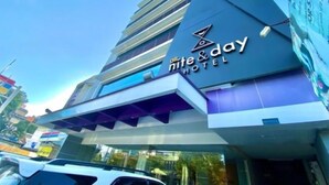 A hotel with a modern design, featuring a prominent 'All Nite & Day Hotel' sign. - ALL NITE & DAY Makassar (Makassar)