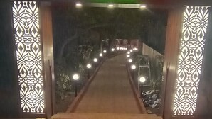 The entrance to Laxmi Resort with a sign reading "Laxmi Resort Pure Veg". - The Byke Laxmi Resort (Karjat)