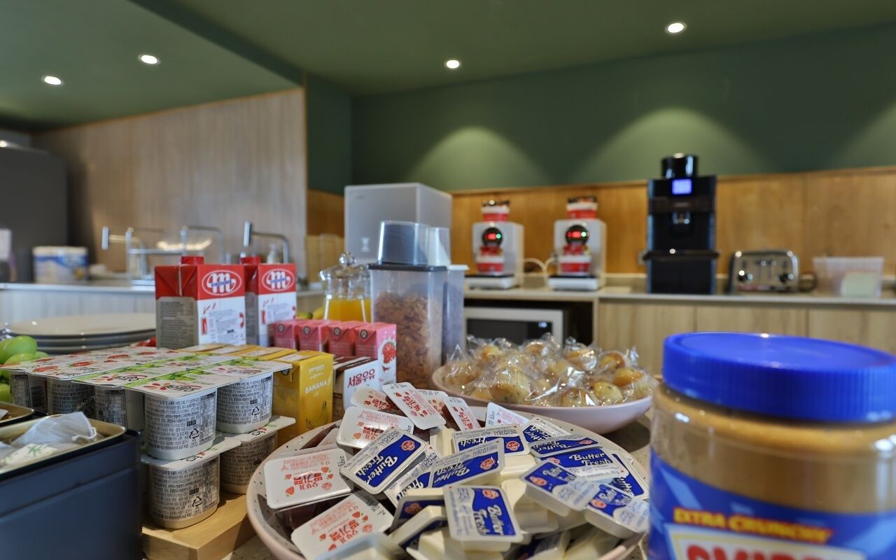 A breakfast buffet with various food items and condiments.