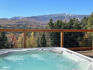 A hot tub on a wooden deck with a mountain view. - Breathtaking Views 7 Bedroom Estate w/Hot Tub (Waitsfield)