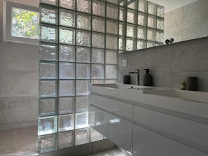 Shower, hair dryer, towels, soap