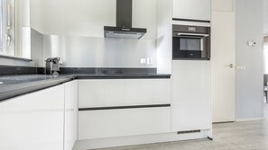 Stovetop, coffee/tea maker, high chair, dining tables