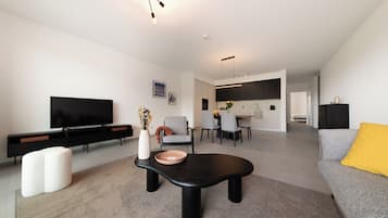 Comfort Apartment | Living area | Flat-screen TV, heated floors