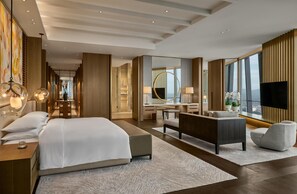 Premium bedding, free minibar items, in-room safe, desk