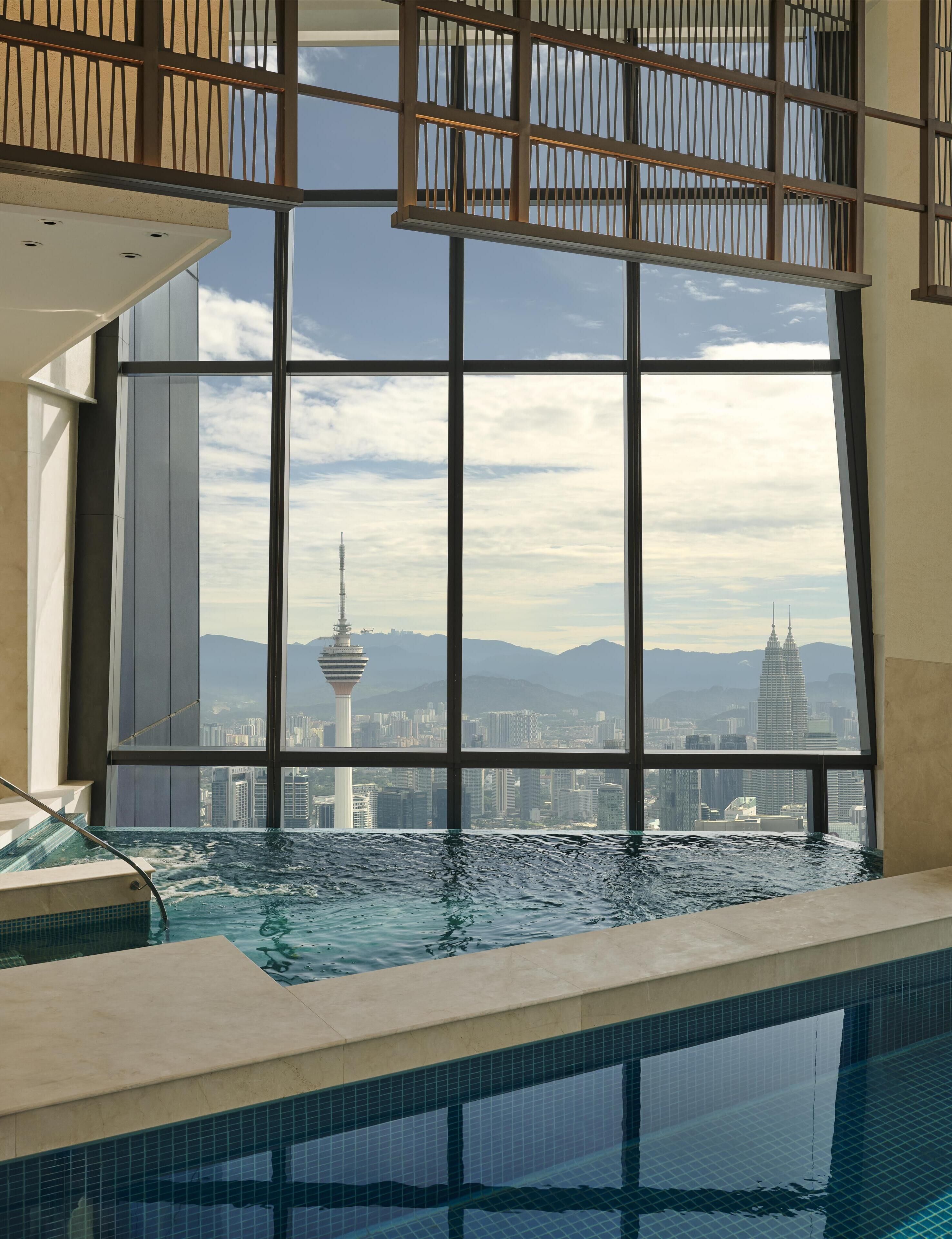 Indoor pool, open 6:00 AM to 9:00 PM, pool loungers