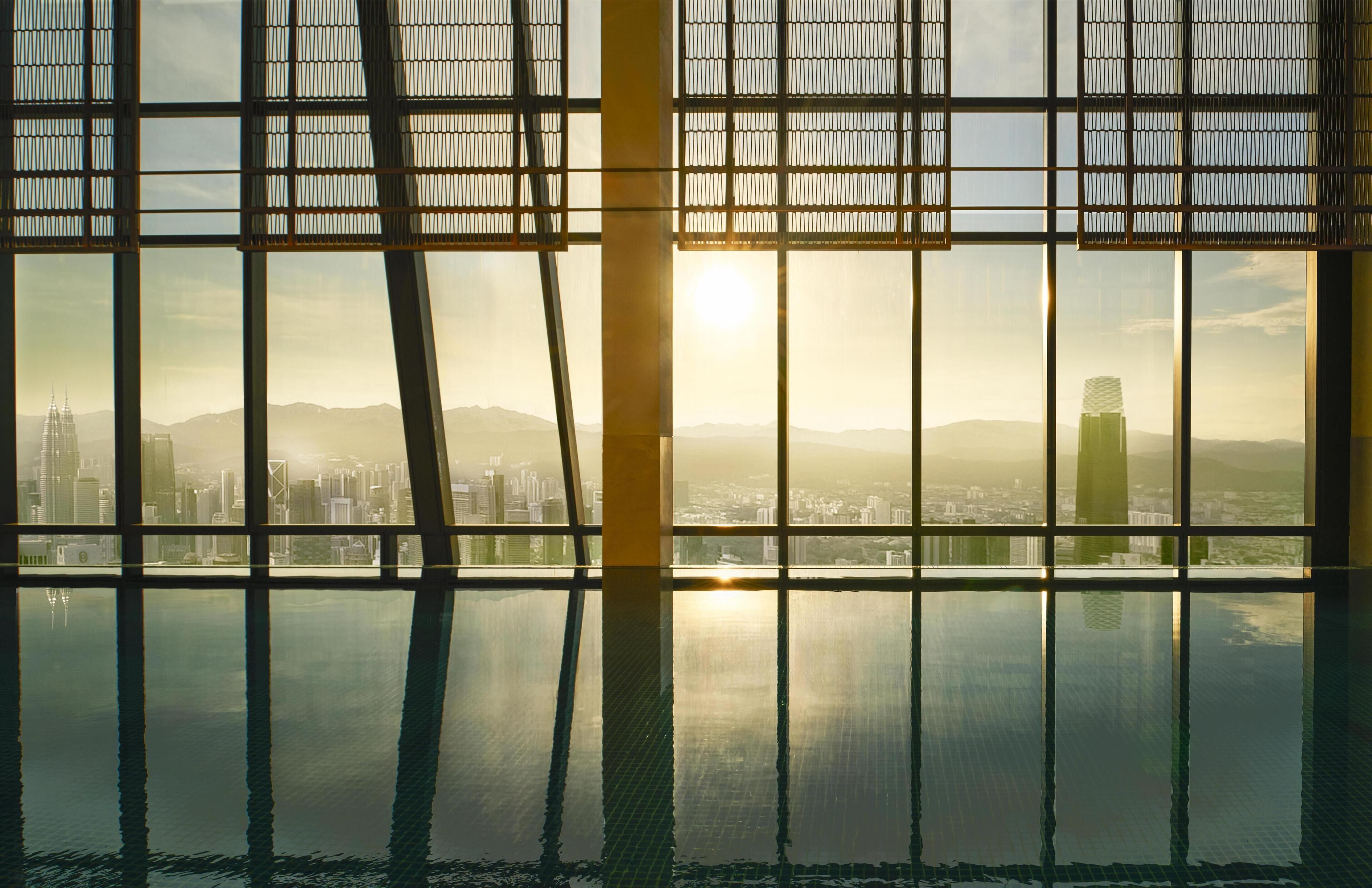 Indoor pool, open 6:00 AM to 9:00 PM, pool loungers