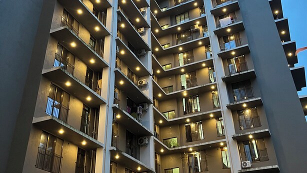 A multi-story residential building with balconies, air conditioning units, and a modern architectural design. - Aleta Residency (Mumbai)