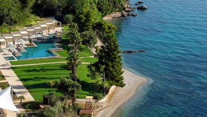 A resort with a pool, green lawns, and a beach area. - Avali, Mar-Bella Collection (Corfu)