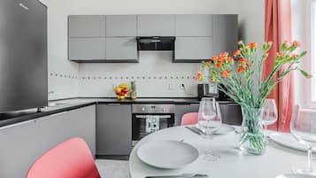Comfort Apartment | Private kitchen | Full-size fridge, microwave, oven, stovetop