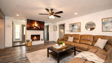 Smart TV, fireplace, foosball, books
