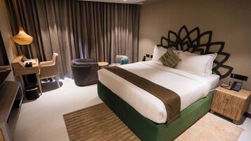 Deluxe King Suite | 1 bedroom, minibar, iron/ironing board, bed sheets