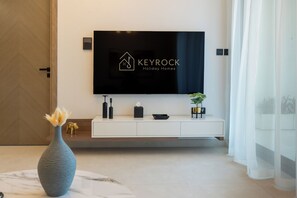 Deluxe Apartment, 2 Bedrooms, City View | Living area | 50-cm Smart TV with digital channels - Trendy 2 Bed in Binghatti Canal (Dubai)