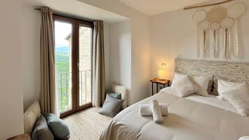 Double Room, Mountain View | Down comforters, individually decorated, individually furnished