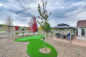 A golf putting green with a gazebo and seating area. - 12 Mi to Flagstaff: Pet-friendly Home w/ Sunroom! (Flagstaff)