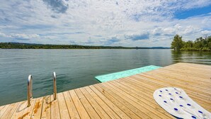 A wooden dock extending into calm water, with a clear sky above. - Branson Gem w/ Hot Tub Access & Private Boat Slip! (Branson)