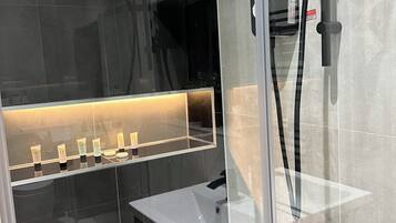 Shower, hair dryer, towels, soap