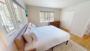 A bedroom with a bed, a dresser, a window, and a wardrobe. - Updated End Unit In Town! Walk to Coffee, Amp, Marina, Parks, Rec Path, Eats (Dillon)