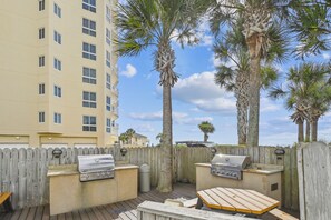 Enjoy al fresco dining on the patio, complete with a barbecue grill and seating area.