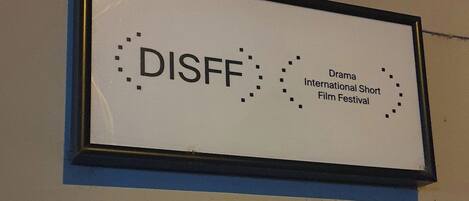 A sign for the Drama International Short Film Festival (DISFF).
