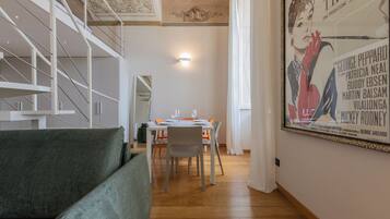 Deluxe Studio, City View | Living area | 35-inch TV with digital channels