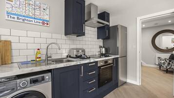 Fridge, oven, toaster, cookware/dishes/utensils