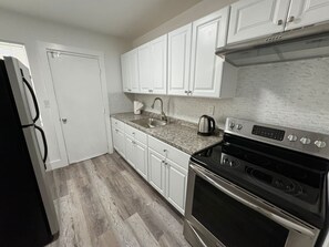 Standard Apartment | Private kitchen | Full-sized fridge, oven, electric kettle, toaster - Remodeled apartments in little havana (Miami)
