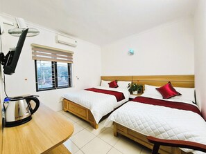 Kamar Triple Deluks | Meja kerja, Wi-Fi gratis, dan seprai linen