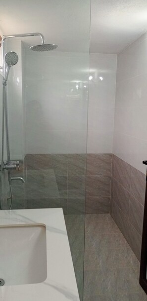 Family Room | Bathroom | Shower, rainfall showerhead, designer toiletries, hair dryer - Heart Hotel MC (Moc Chau)