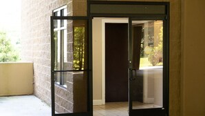 A revolving door with glass panels, leading to a building entrance. - Modern 2BR Condo in Gatlinburg (Gatlinburg)