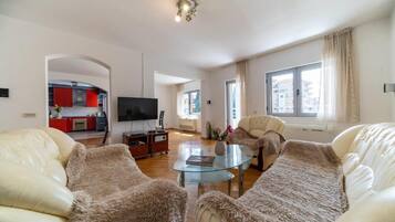 Premium Apartment, Balcony | Living area | 32-inch LCD TV with cable channels