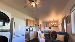 A compact living space with a kitchenette, dining area, and seating. - 
Charming Riverside Cabin on Yellowstone River - 2 Bedrooms & 2 Bathrooms, Relax (Gardiner)