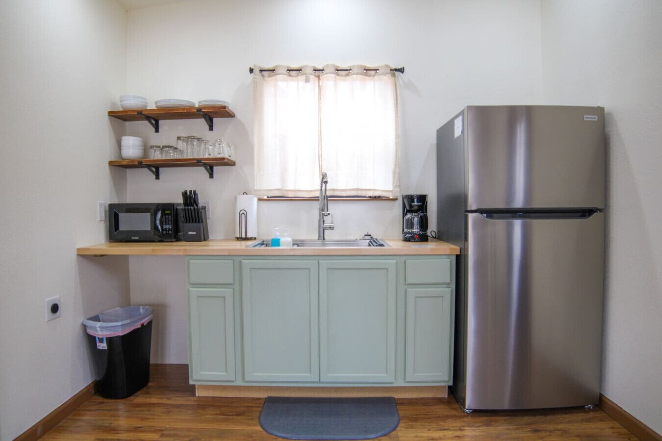 Fridge, microwave, coffee/tea maker, cookware/dishes/utensils