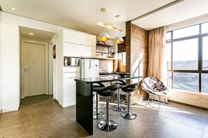 Basic Apartment | Private kitchen | Fridge, microwave, cookware/dishes/utensils