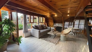 Casa de campo Confort, vista al jardín | Área de sala de estar