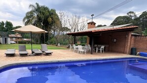 A swimming pool with lounge chairs and a covered patio area. - Incredible Property with Huge Garden and Pool! (Valle de Bravo)
