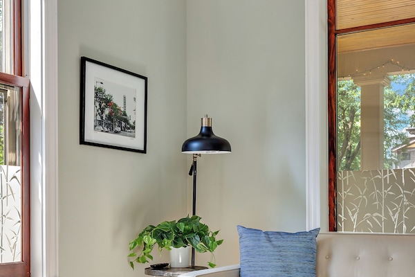 Living Room is filled with light from 7-foot windows and 79" Room & Board couch.