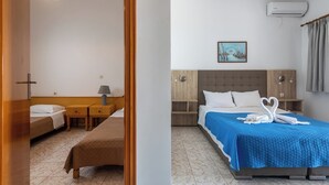 A hotel room with a bed, a bedside table, a lamp, a wall-mounted air conditioner, and a painting on the wall. - Seafront apartment in the bay of Kefalos, Kos (Kefalos)