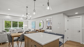 A modern kitchen with a central island, wooden cabinets, and pendant lighting. - 2 Bed/2 Bath Sparrowhawk Resort-Sleeps 6 (Dead Man's Flats)