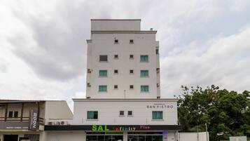 A multi-story building with a sign for 'RESIDENCIAL SAN PIETRO' at the top.