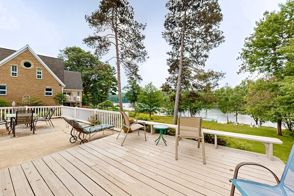 Outdoor dining - Gorgeous lakefront home with dock, sandy beach area, fireplace, huge deck & WIFI (Minocqua)