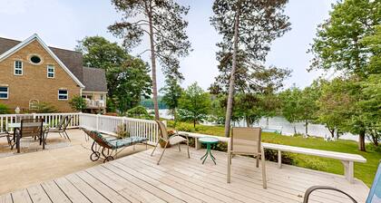 Gorgeous lakefront home with dock, sandy beach area, fireplace, huge deck & WIFI