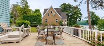 Gorgeous lakefront home with dock, sandy beach area, fireplace, huge deck & WIFI
