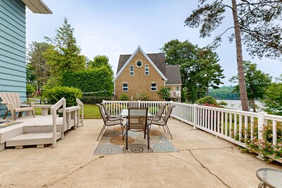 Gorgeous lakefront home with dock, sandy beach area, fireplace, huge deck & WIFI