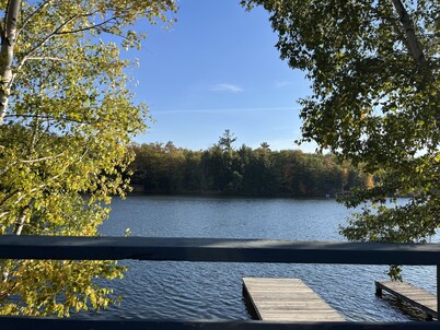 Gorgeous lakefront home with dock, sandy beach area, fireplace, huge deck & WIFI