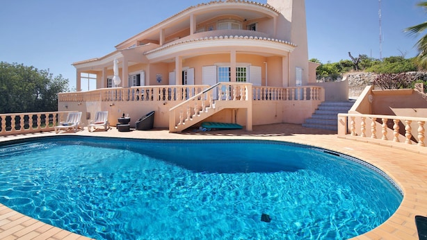 A large house with a swimming pool, a staircase, and a balcony. - Country House 'Quinta Da Violeta' with Sea View, Wi-Fi and Air Conditioning (Loulé)