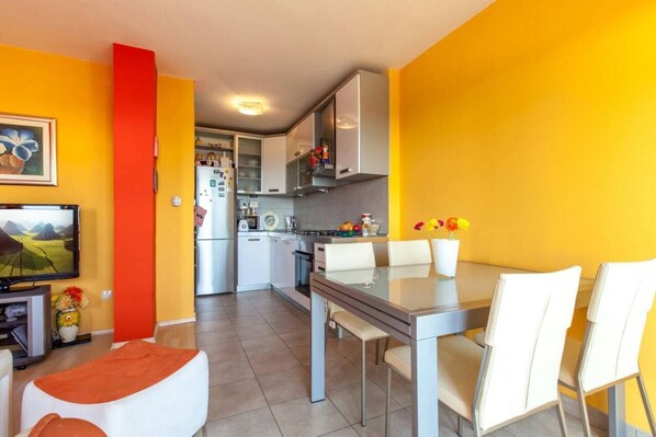 Cozy living space with a kitchen, dining area, and comfortable seating.