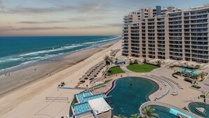 A beachfront hotel with a pool, beach, and ocean view. - Las Palomas Phase I Topaz 202 Exceptional OceanView 1BR 1BA Unit. (Puerto Peñasco)