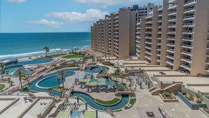 A resort with multiple swimming pools, a beach, and high-rise buildings. - Las Palomas Phase I Topaz 202 Exceptional OceanView 1BR 1BA Unit. (Puerto Peñasco)
